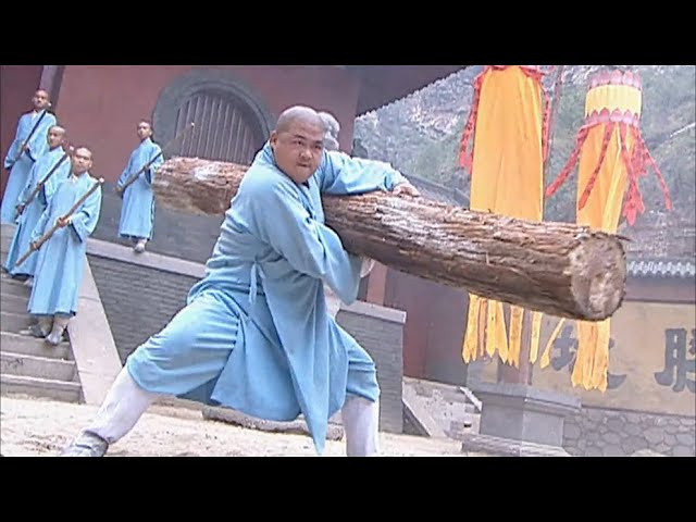 Shaolin monk confronts the bullies, and the monk uses thousands of pounds of wooden stakes so deft