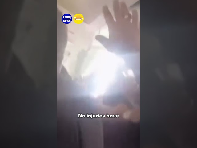 Plane's ceiling collapses in mid-air | 9 News Australia