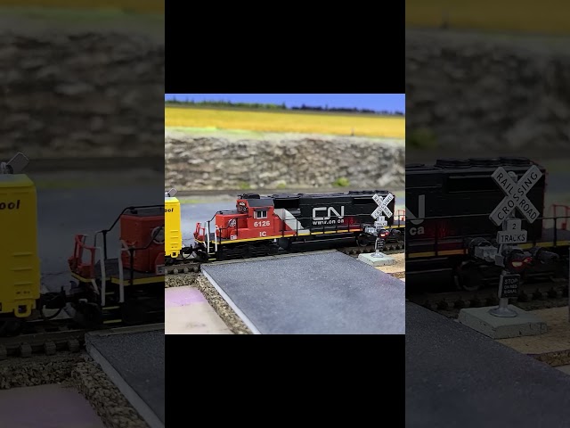 SD40-2 moving some box cars