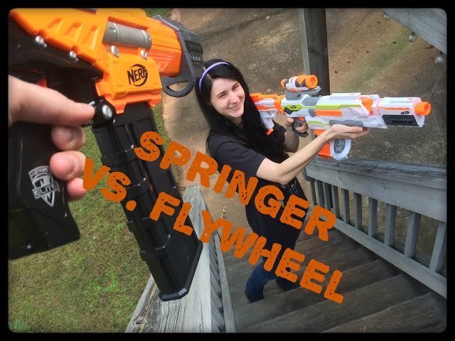 NERF WAR: Flywheel Gun Vs. Springer Gun.  (Drac Vs. Draculina)