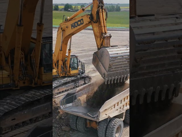 Komatsu 1250 loading a 777, 775 and a 773
