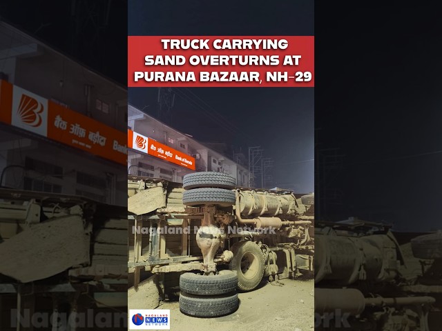 TRUCK CARRYING SAND TOPPLES AND CRASHES ONTO DIVIDER AT PURANA BAZAAR, DMP