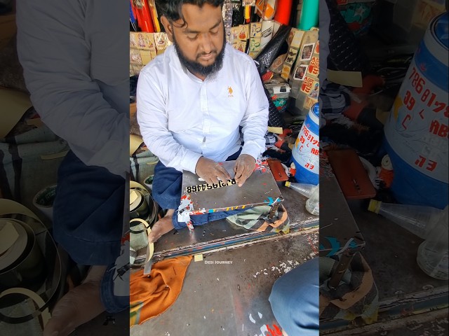 An illiterate village boy transformed an old number plate into a new one using his hands