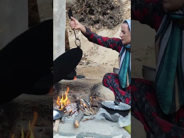 nahid baking bread in the mountains