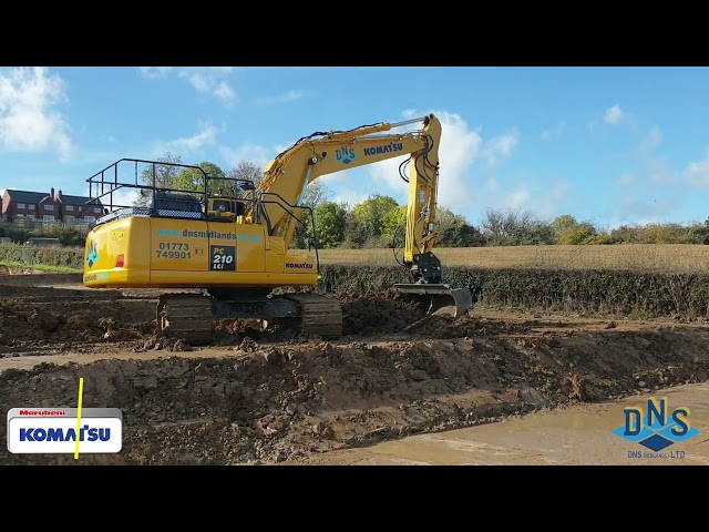 DNS Midlands Komatsu PC210LCi Excavator prepping ground for footings in this housing development.