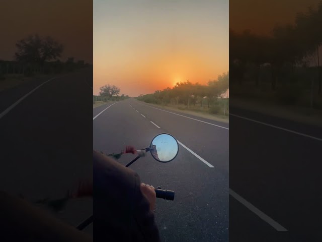 Driving through the desert at sunset ๐
