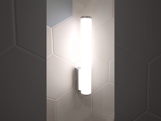 Installing a wall lamp in the bathroom