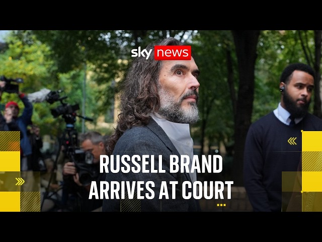 Russell Brand arrives at court ahead of trial