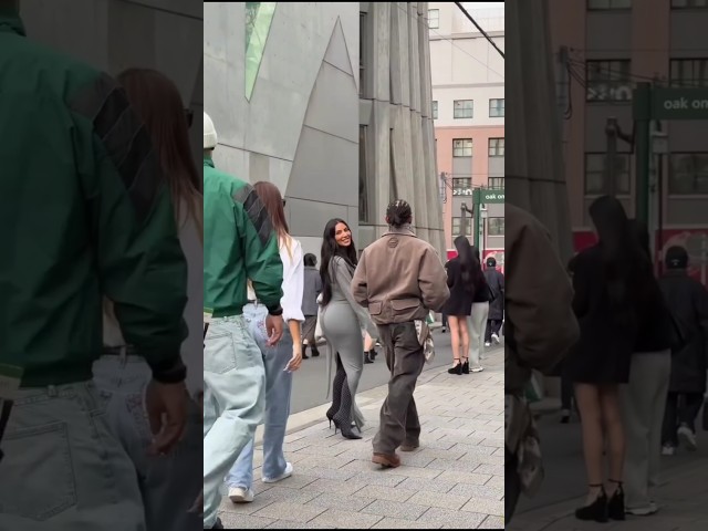 Kim Kardashian smiles at fans while strolling arm in arm with Lewis Hamilton in Tokyo