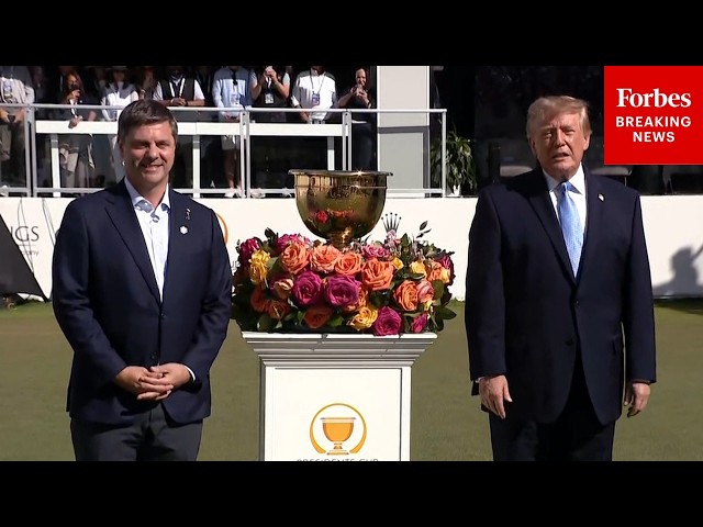 President Donald Trump Greets Golfers And Poses With Trophy During Presidents Cup Closing Ceremony