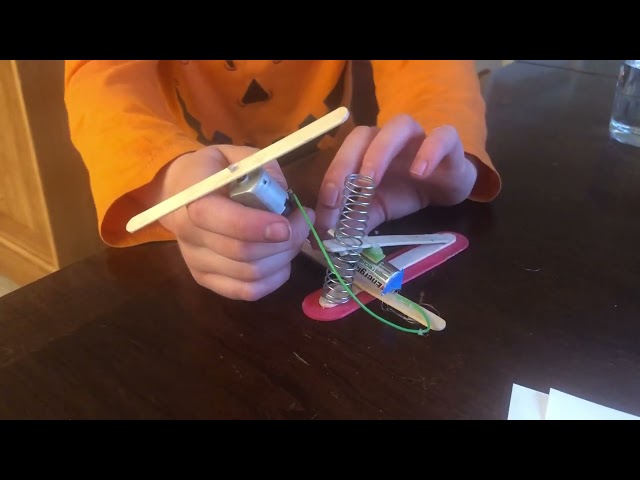 My son creating his own button from scratch