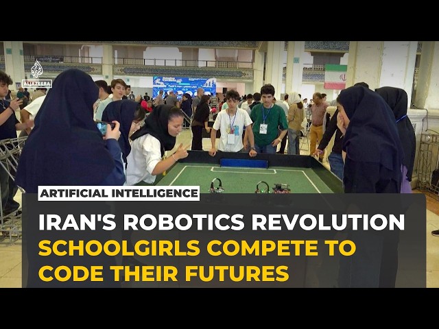 Iranian schoolgirls compete in robot football at Tehran's RoboCup
