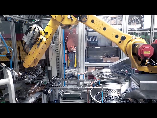 Riveting machine with a Fridrich riveting device, a rotary table and robotic part loading.