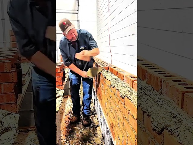 trowel spreads mortar as bricks align with precision #bricklaying #masonry