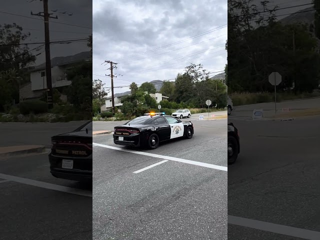 2X California highway patrol units responding to a vehicle over the side