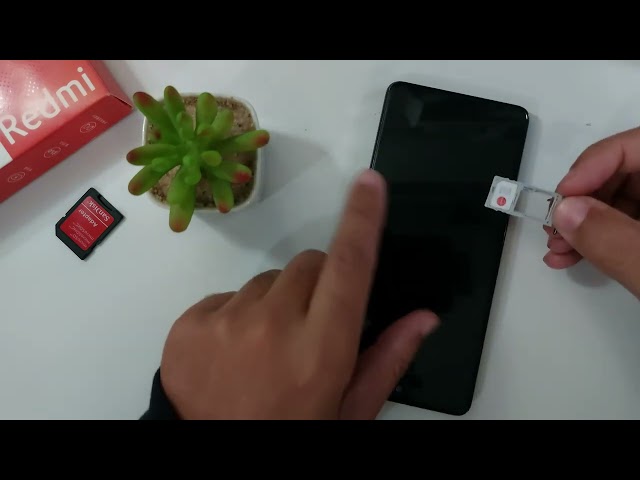 How to open the SIM card slot on the Xiaomi Redmi 13