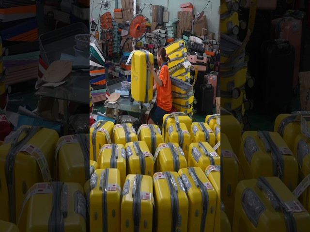 Satisfying mass production of suitcases. Process of efficient Vietnamese workers making suitcases.