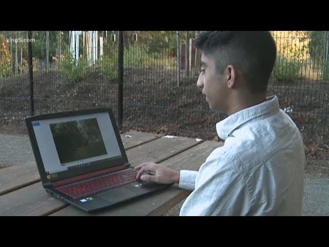 Student using computers to help wildlife