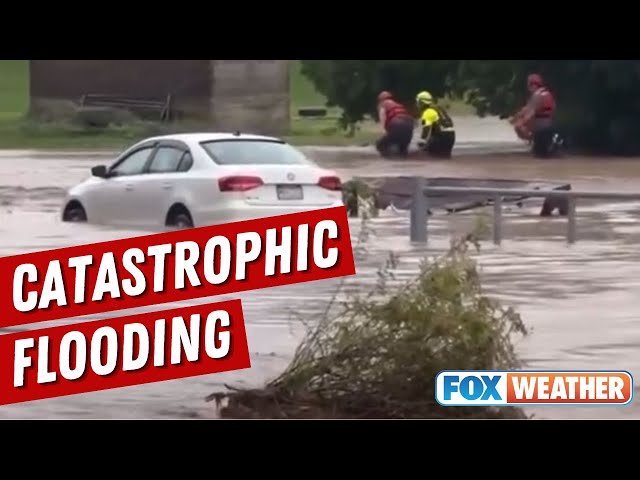 Firrefighters Wade Through Catastrophic Flooding In Westfield, Pennsylvania, To Rescue Family