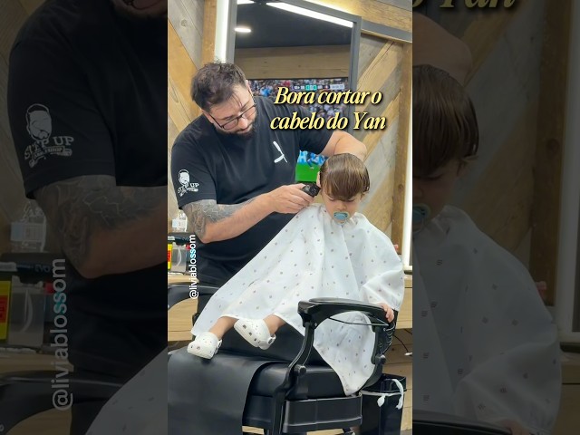 Ian getting a haircut, Brazilian barber in the US.