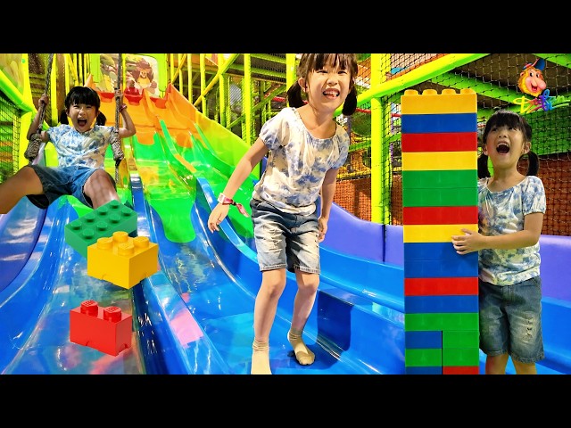 Play on colorful slides, swings, and blocks at the Dufan Playground