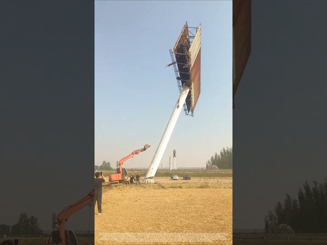 Excavator Demolishes Giant Billboard