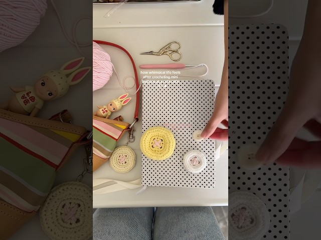 crocheting mini buttons at a cute cafe🧚🏻 you can turn them into keychains and hair clips! #diy