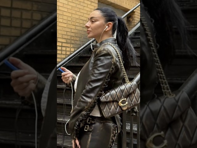 Charlie XCX wearing the Coach Quilted Tabby