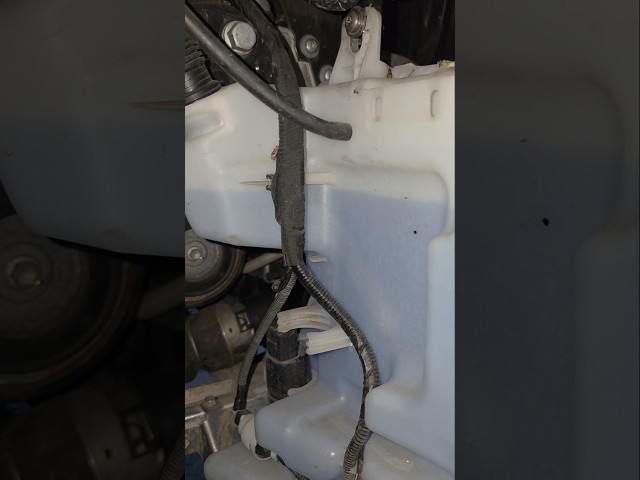 BMW X1 windscreen wiper washer jets bottle and washer jets pump location.