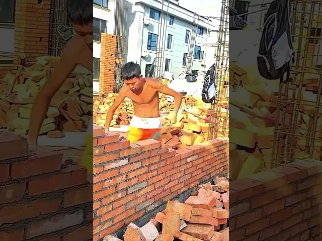 trowel spreads mortar as red bricks build the wall #bricklaying #masonry