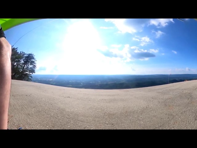 360 degree video of a windy cliff launch with 3-man wire crew - Bullseye landing!