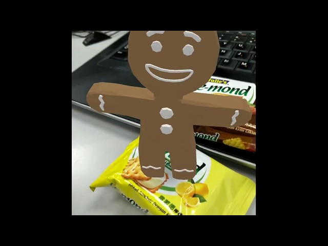 Gingerbread man standing on top of Le-mond