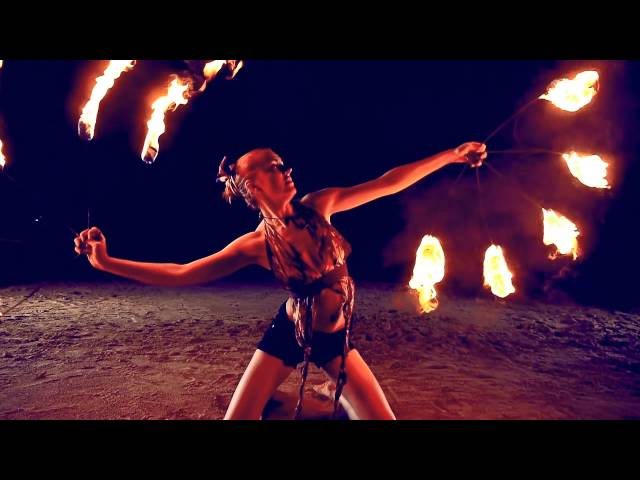 Fire dancing duet. Poi and fire fans