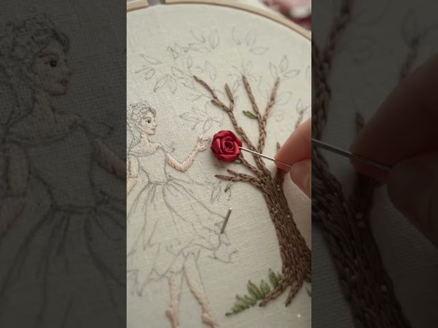 fairy standing beside blooming Rose tree