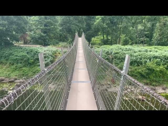 Walking from England to Wales over the River Wye rope-bridge.