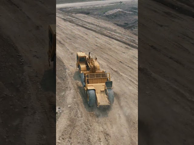 Komatsu 155ax pushing buggies