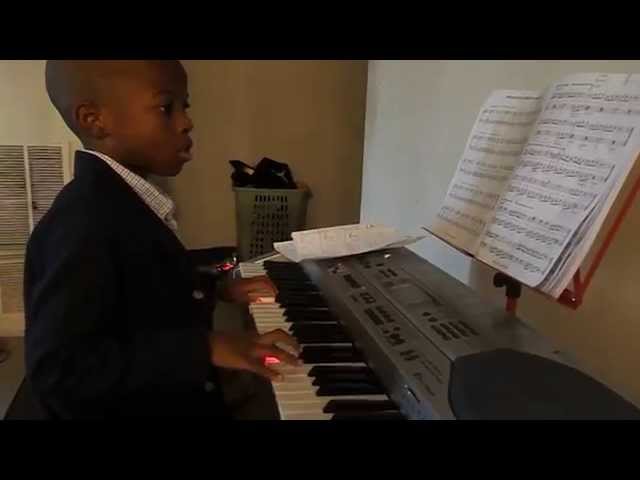Omolere Oyewole playing preliminary piano pieces
