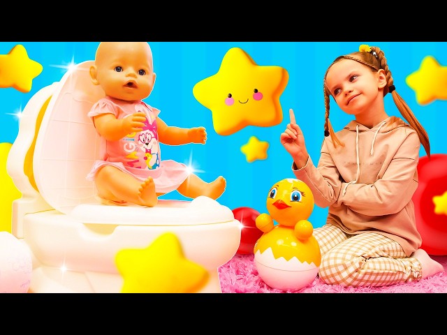 Maya shows her doll how to use the toy potty, helps her get dressed, and goes for a walk.
