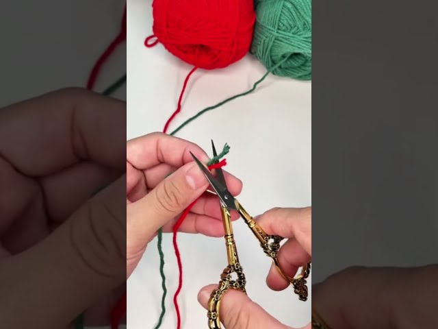 cutting the excess yarn tails