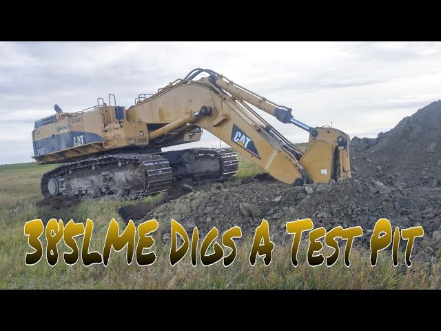 Cat 385LME Digs A Test Pit