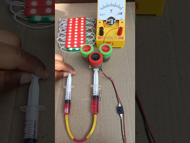 DIY Project: Syringe-Powered Wheel Spins 2, Generators - 30 Green LED | DC Moving Coil Voltmeter.