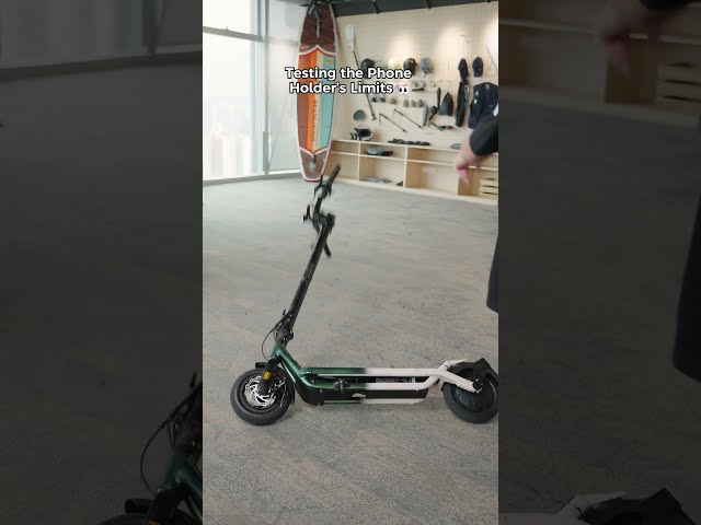 Your phone isn’t going anywhere. 📱💨#fiido  #escooter  #phoneholderstand #fiidoescooter #wheelie