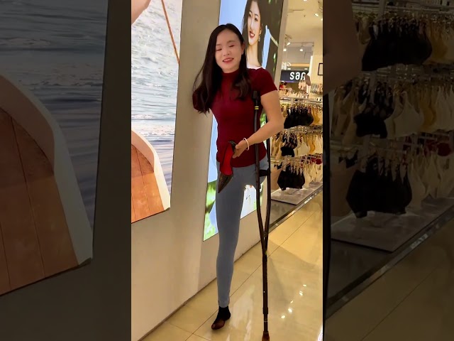 Mila OOE amputee adjusts her heel while walking