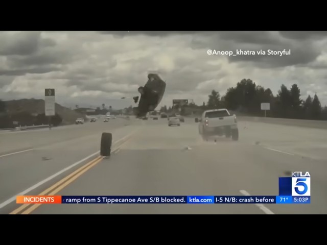 Runaway tire sends car flying into the air