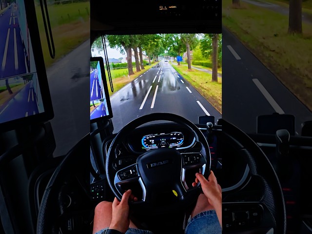 A man is driving a truck with a trailer along Dutch roads in the summer rain POV 4K 60 FPS trucker