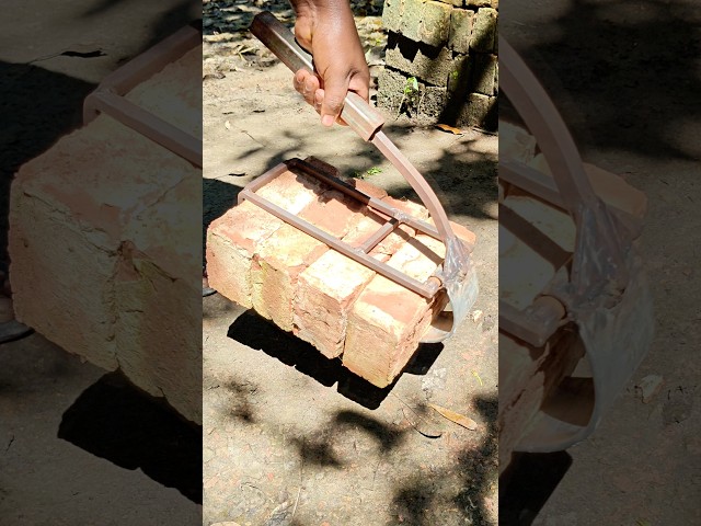 Gripping Building Materials, Foot-Activated Lever Hoists Red Bricks At Once