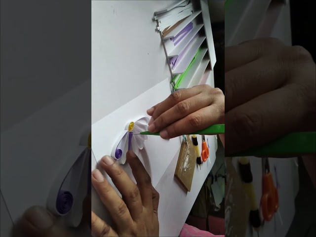 Outline quilling a flower and butterfly