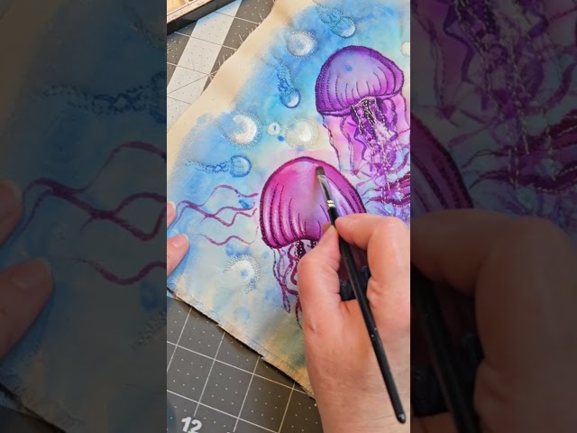 a few final touches....jellyfish watercolor on fabric