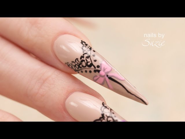 Hand Painted Stockings and Bows on Stiletto Nails