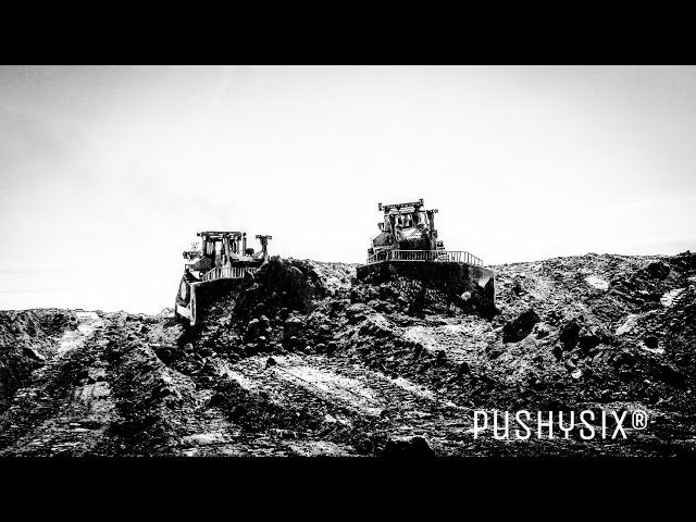 Two Caterpillar D11's working side by side